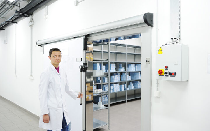 A pharmacist at the door of the temperature-controlled storage room
