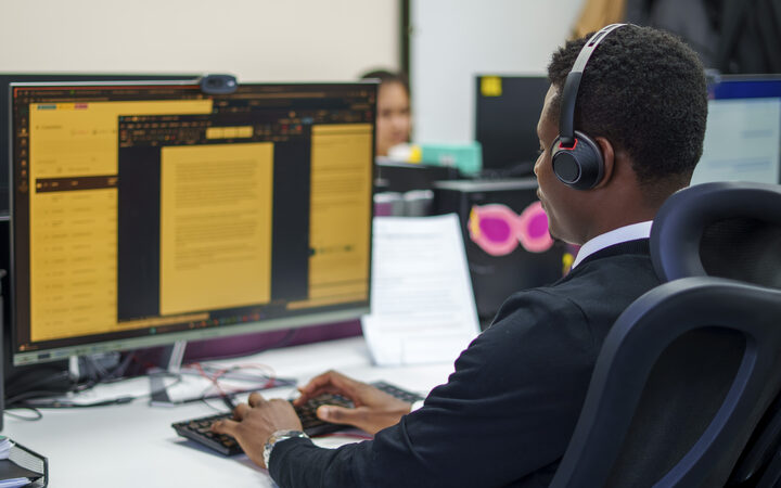 A Personal Homecare Pharmacy adviser taking a call at their desk